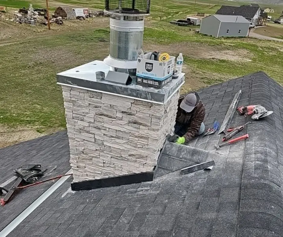 Chimney flashing repair on a roof in Bozeman, Montana
