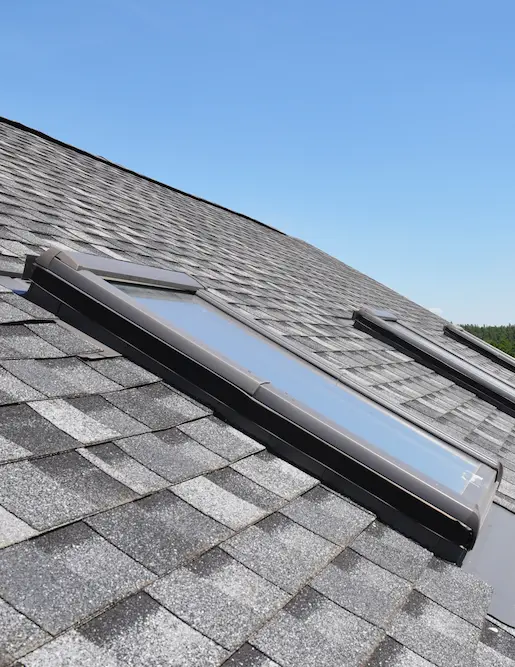 3 Velux skylights on a comp roof in bozeman