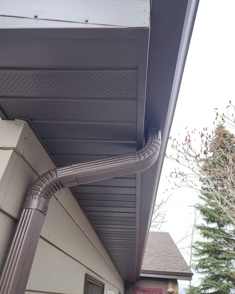 new gutter downspouts on a home in Bozeman MT - Top Edge Roofing
