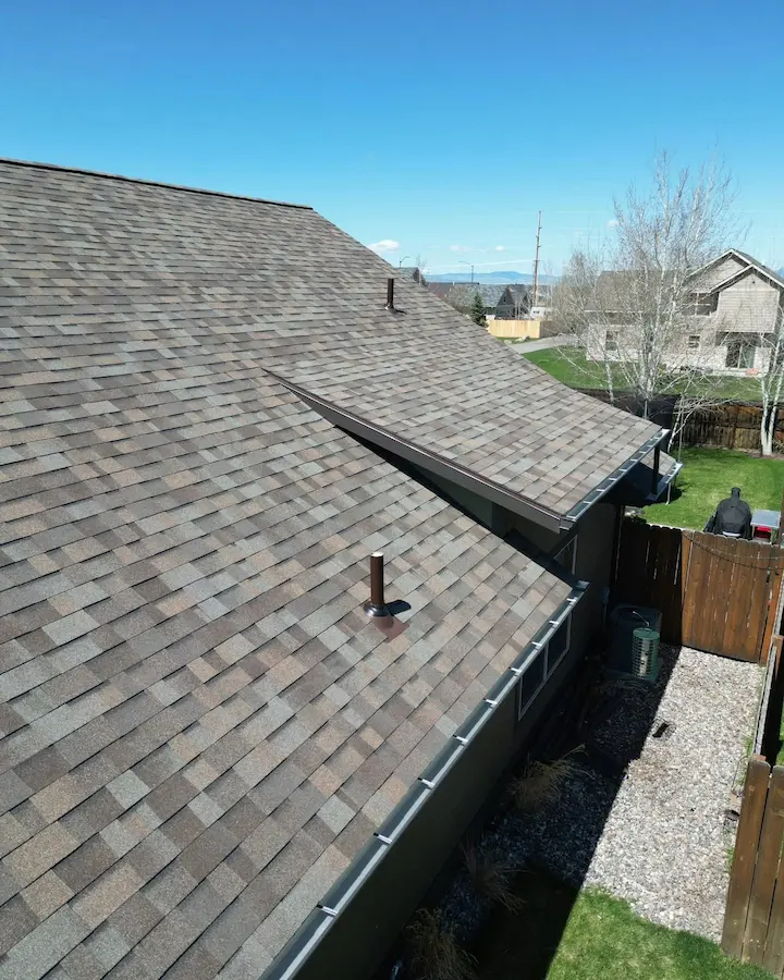 gutter service on a new roof in Bozeman MT - Top Edge Roofing