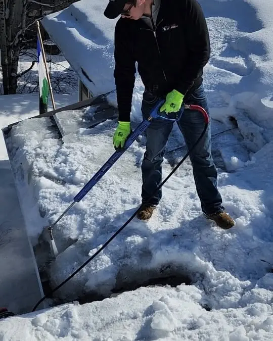 ice dam removal with low-pressure steam in Bozeman MT - Top Edge Roofing